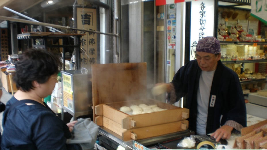 Steaming buns are sold fresh and hot from the traditional wooden-frame steamers.